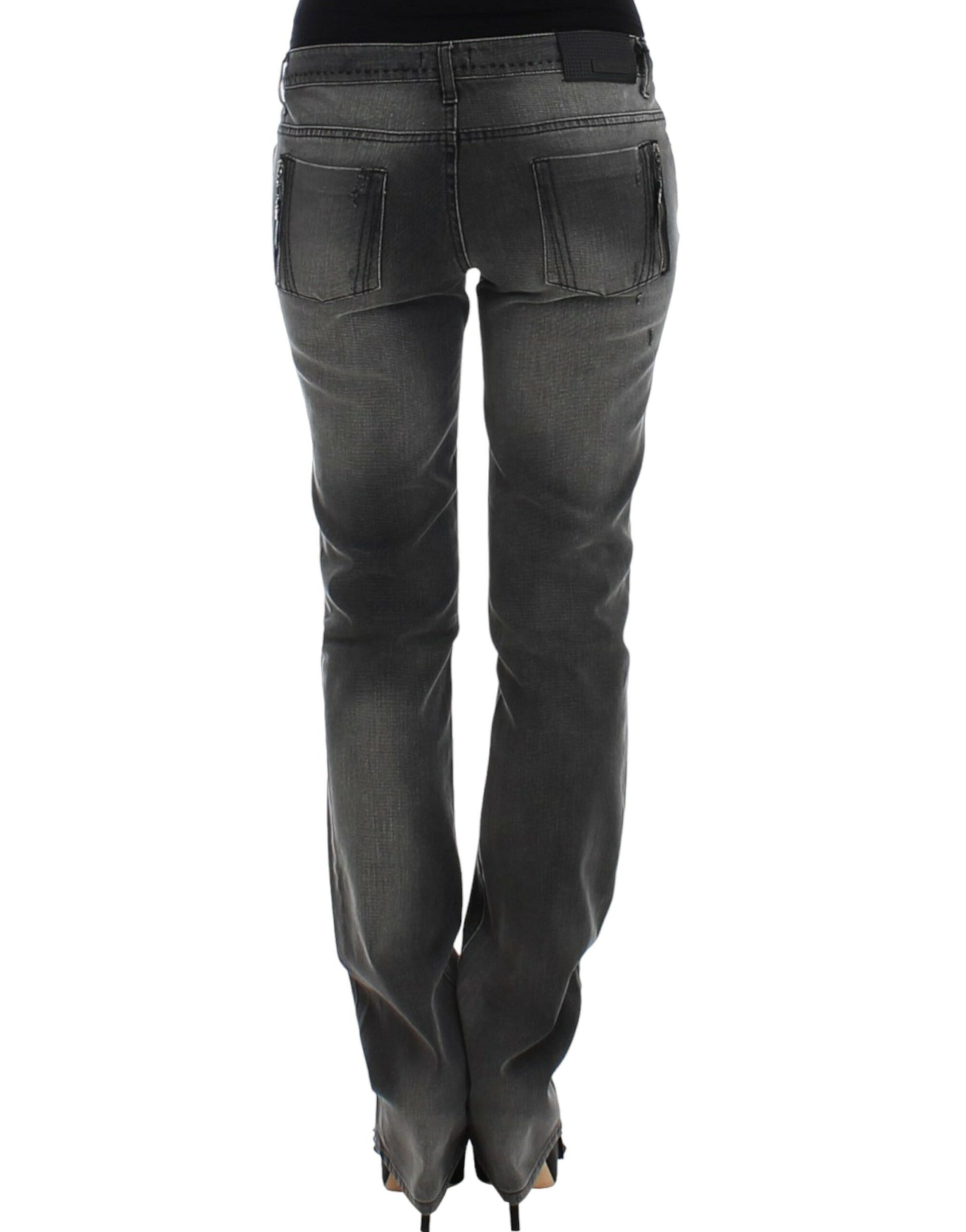 Pair of women's jeans with faded wash and rolled up legs