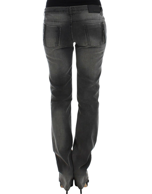 Pair of women's jeans with faded wash and rolled up legs