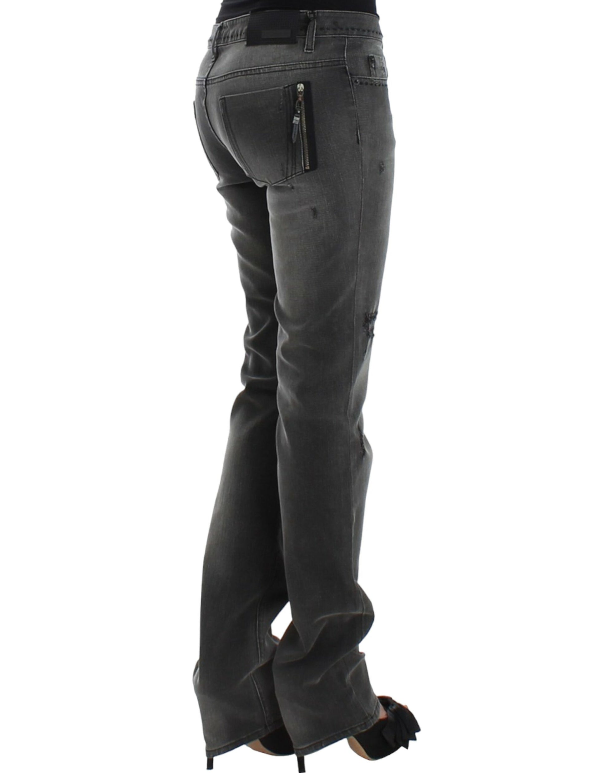 Pair of women's jeans with zippered back pocket and rolled up legs