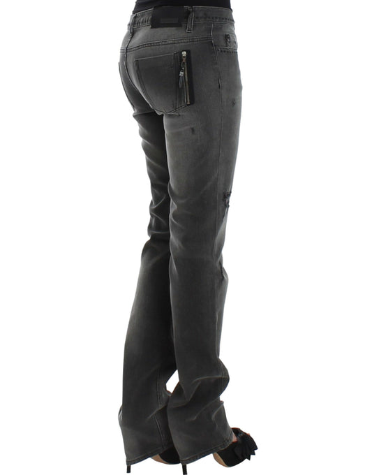 Pair of women's jeans with zippered back pocket and rolled up legs