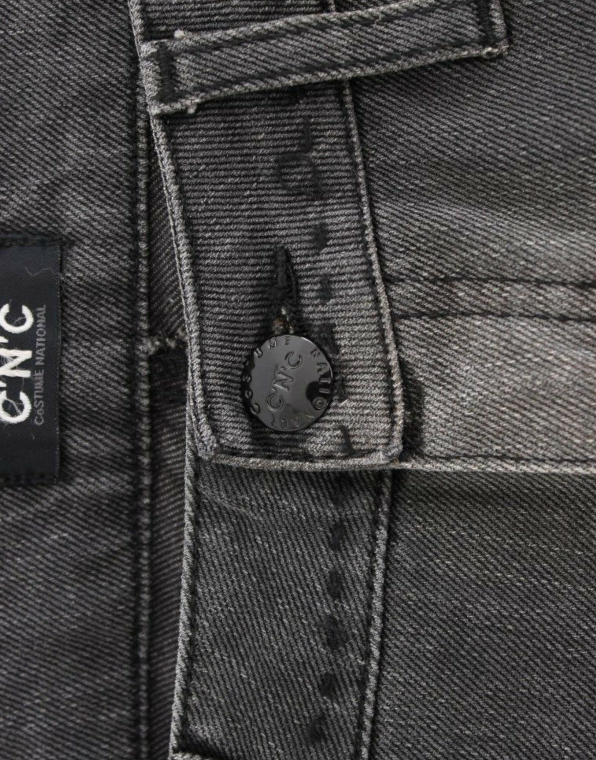 Pair of blue jeans with a button and rivets on the waistband