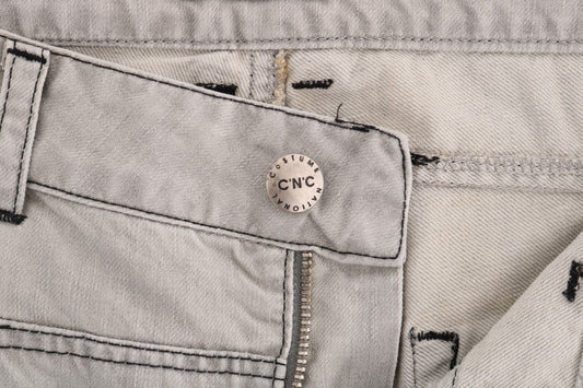 Denim jeans with button closure