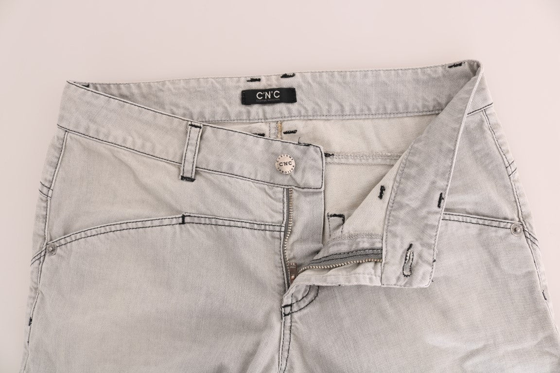 Pair of light blue denim shorts with zippered pockets