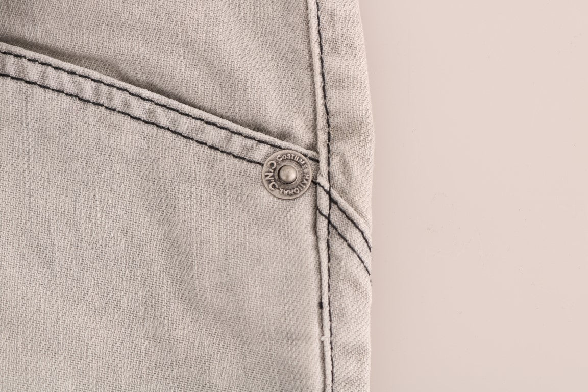 Pair of light wash jeans with button closure