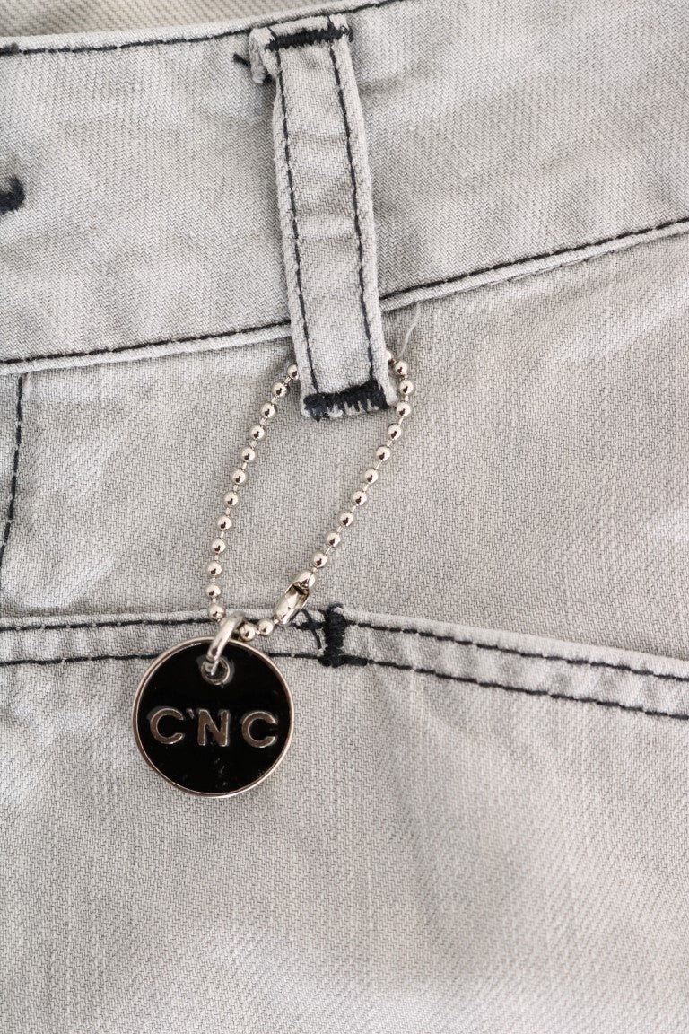 Silver necklace with black pendant reading "CNC"