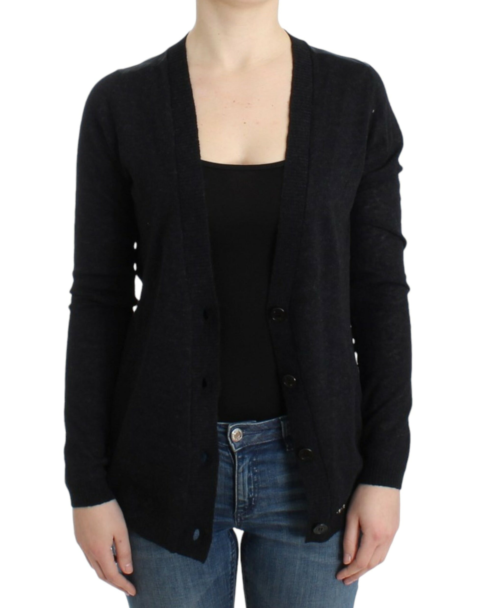 Woman wearing a black cardigan over a black top