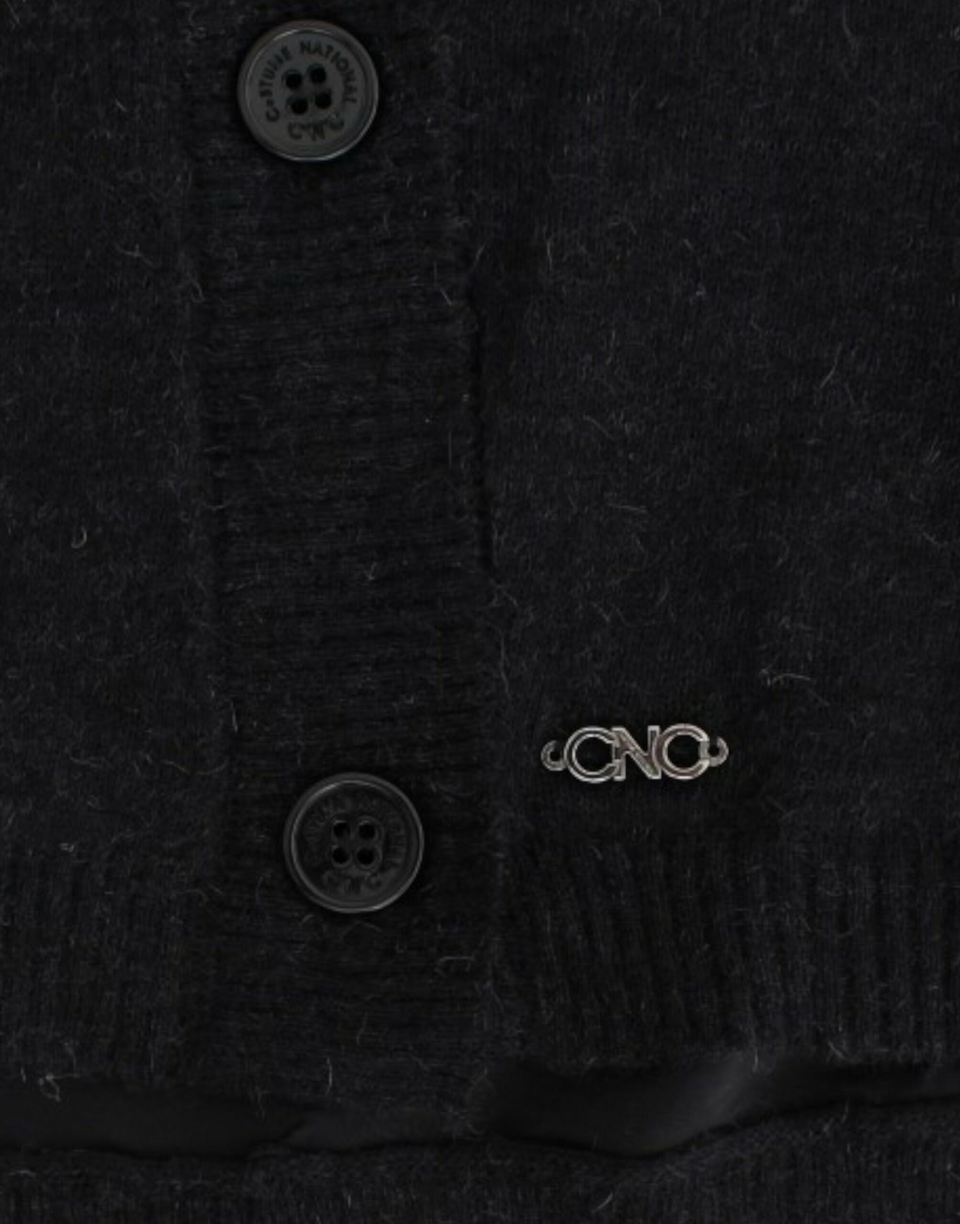 Black wool sweater with buttons and a silver pin