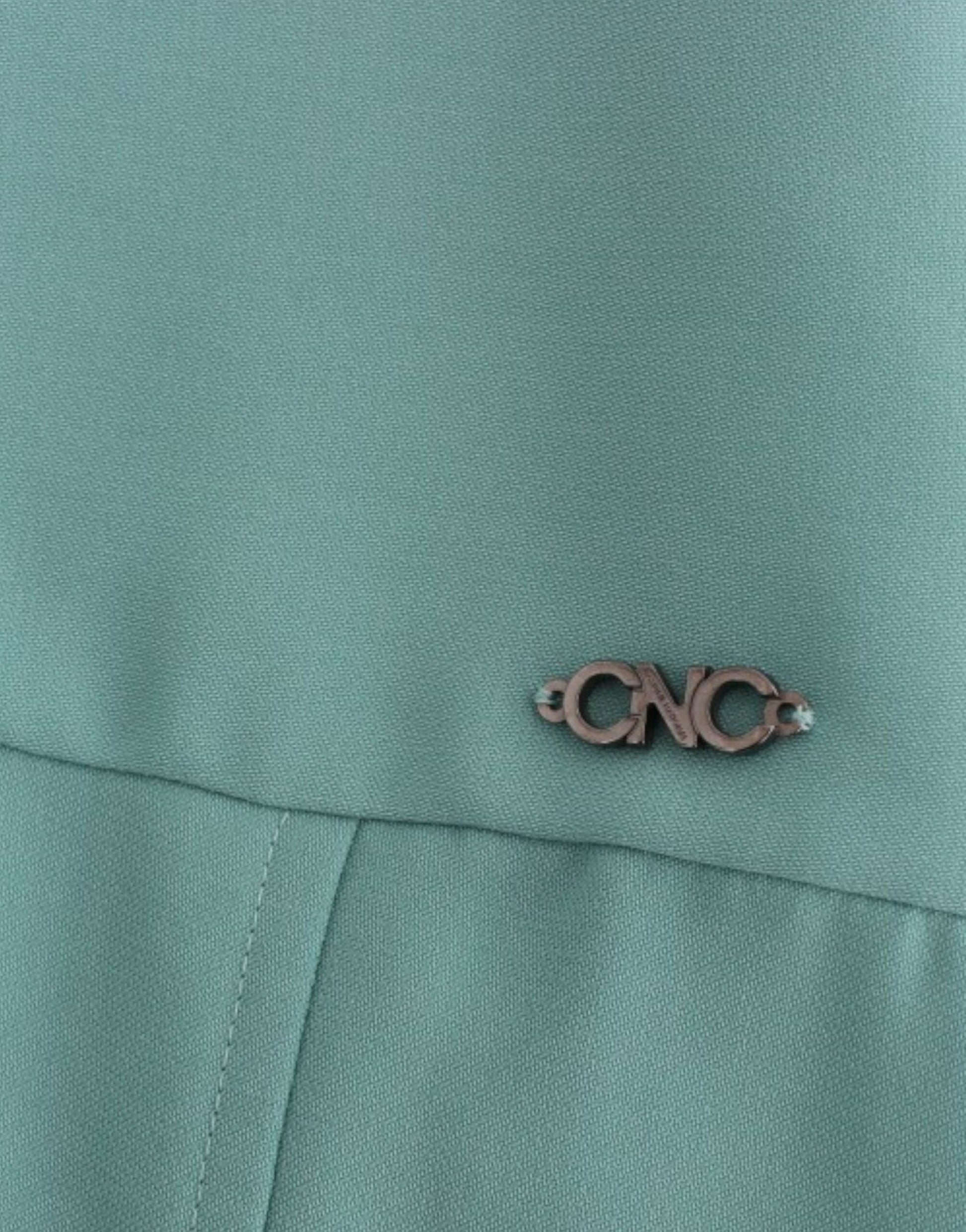 The pin is on a green jacket