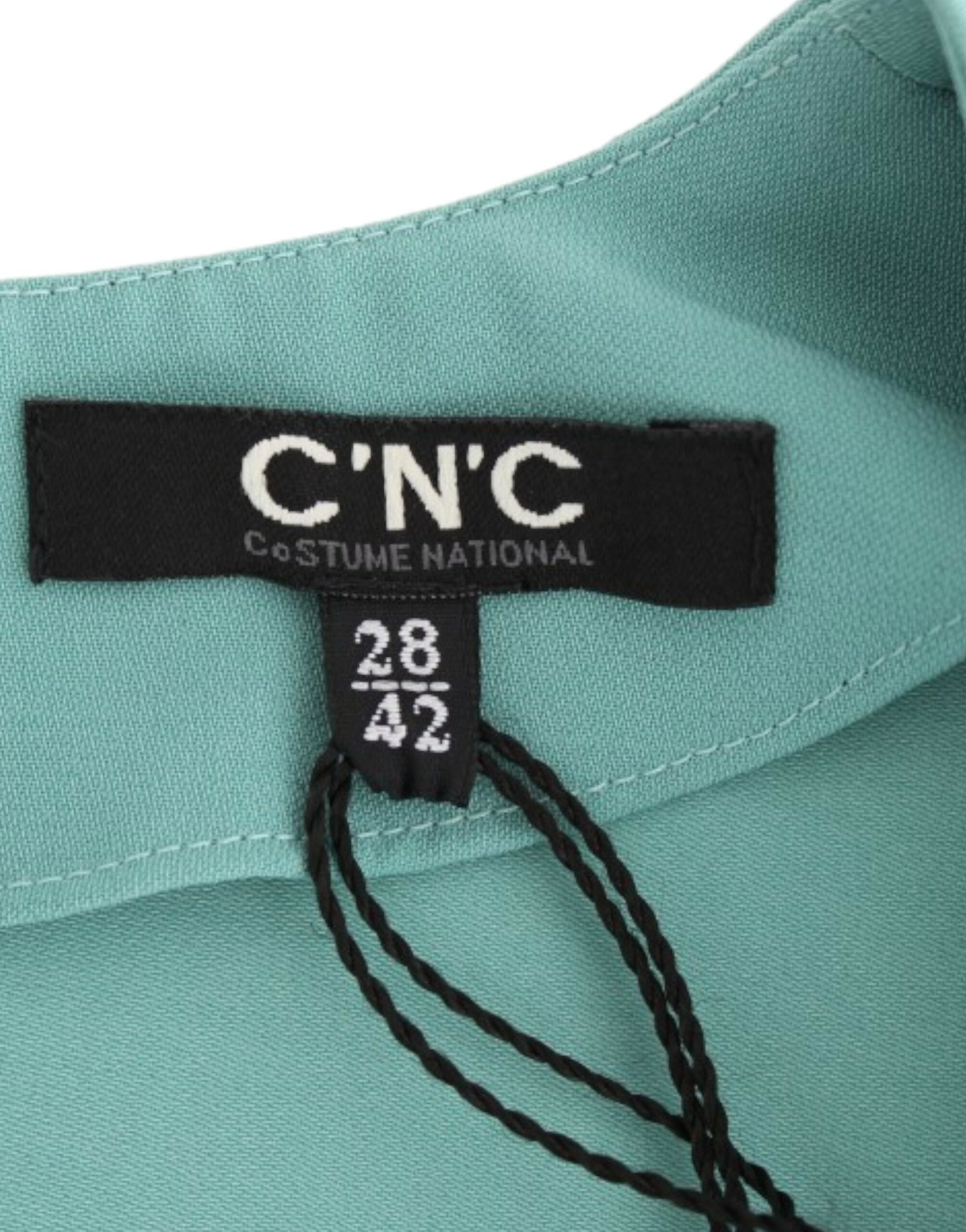 Green shirt with black label