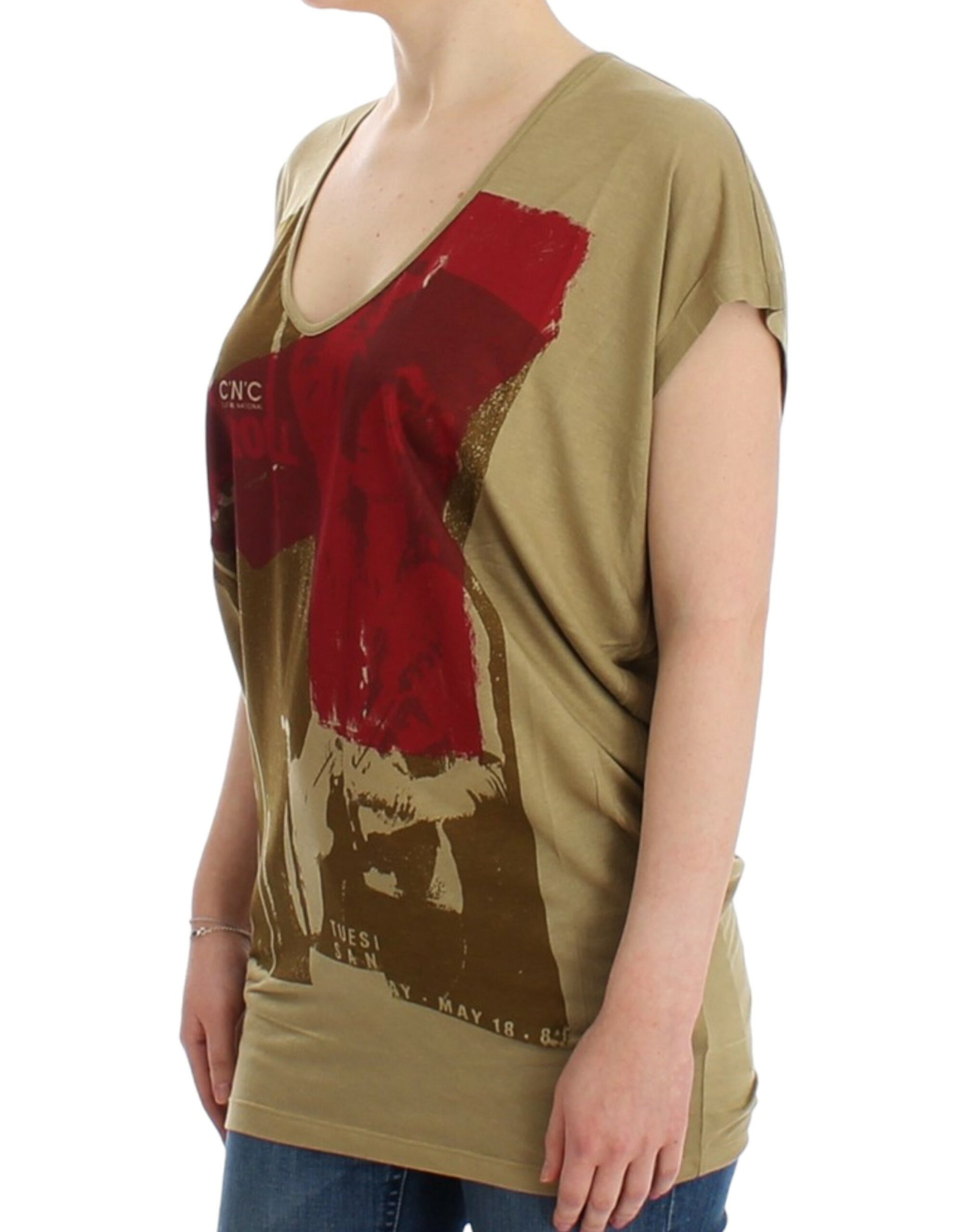 Woman wearing a brown t-shirt with red design on front