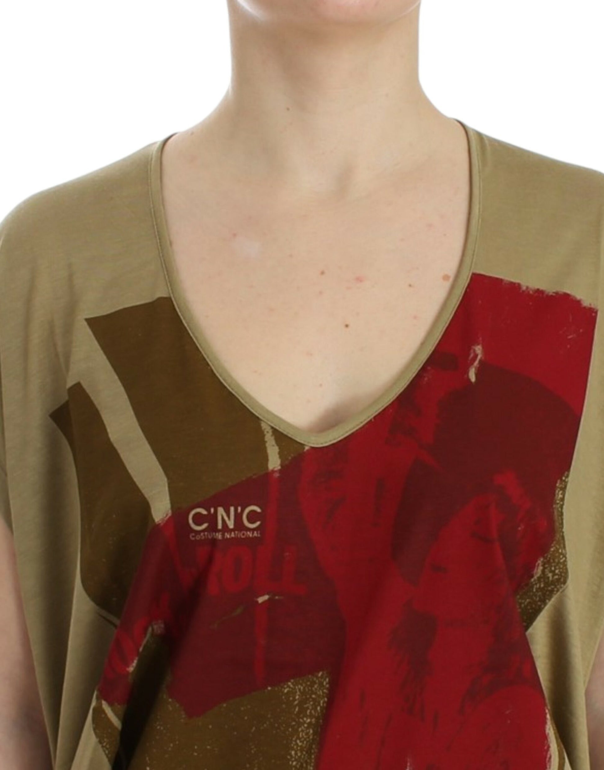 Woman wearing a v-neck shirt with red and brown design