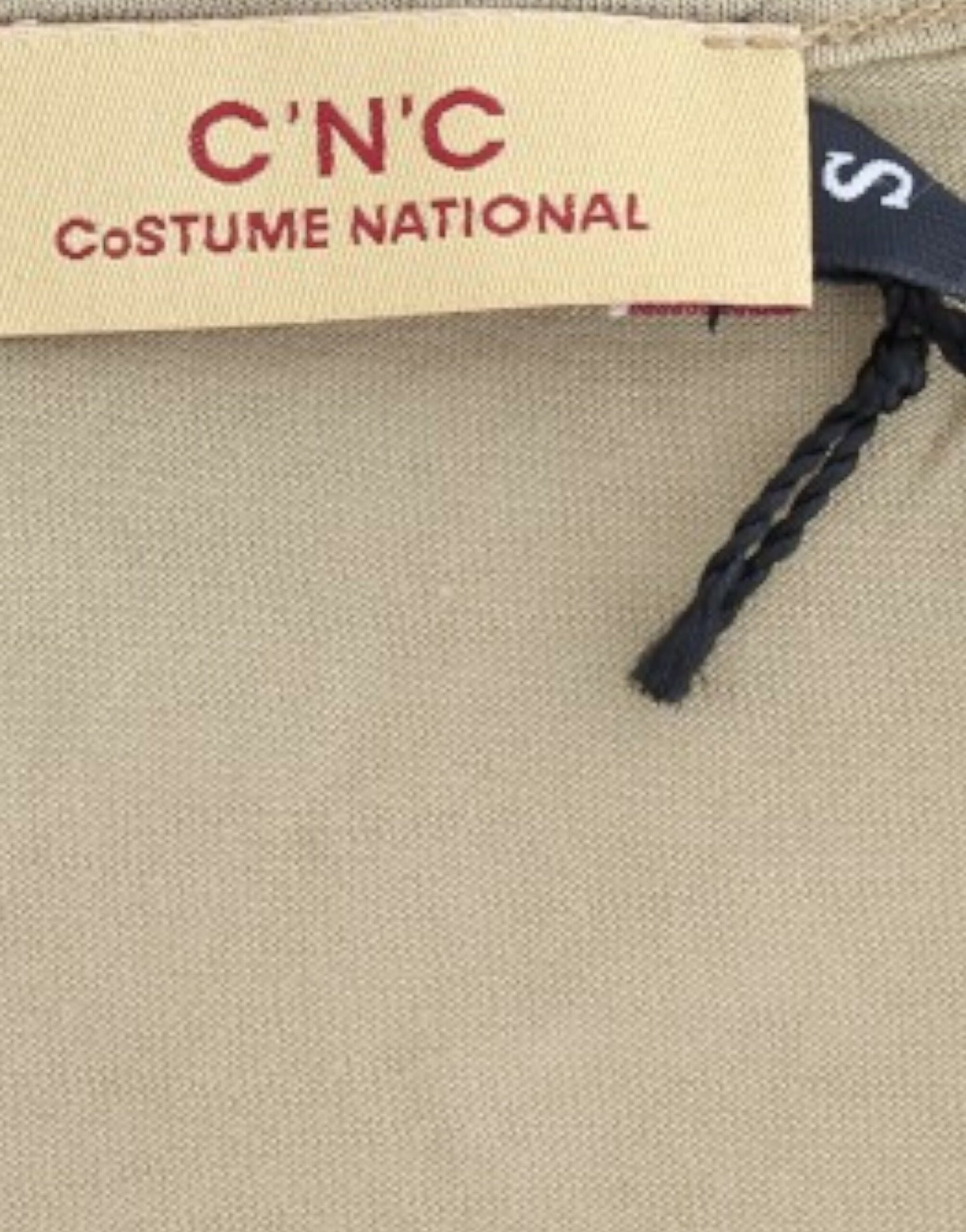 Tan fabric with red lettering on a tag