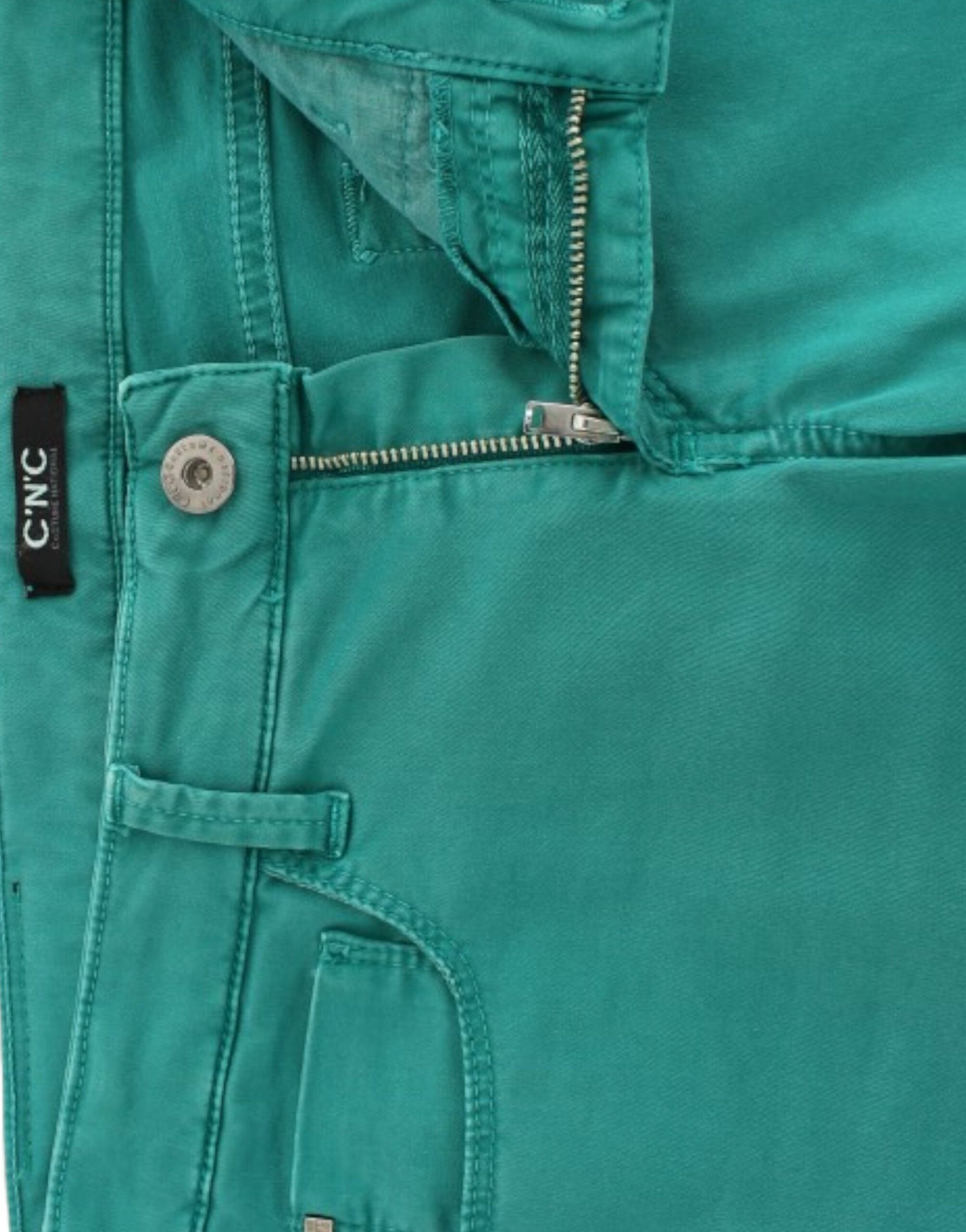 Pair of green jeans with zippered pockets and a button closure