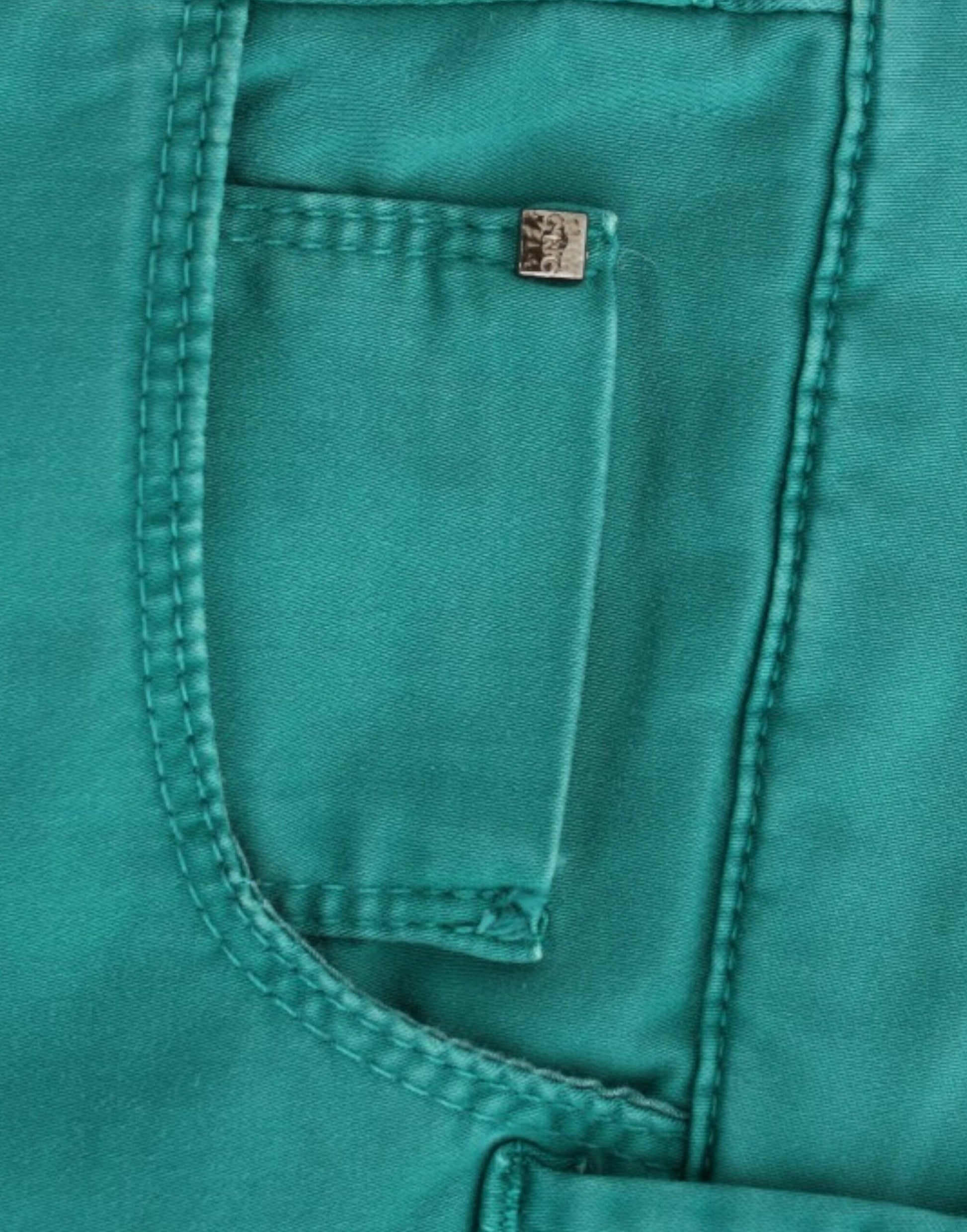 A pair of blue jeans with a visible front pocket