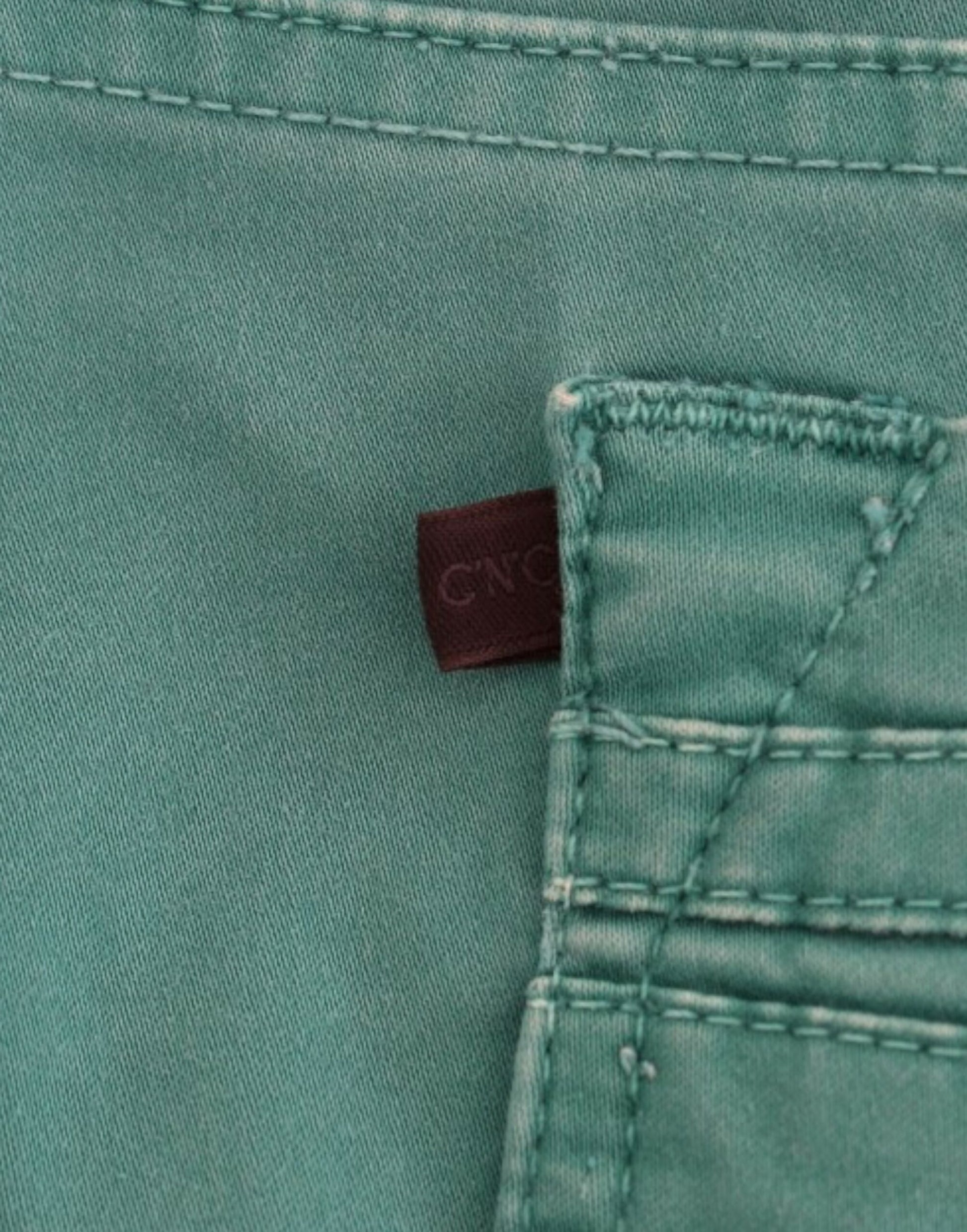 A pair of jeans with a visible label on the waistband
