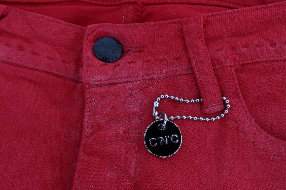 Silver key chain attached to red jeans