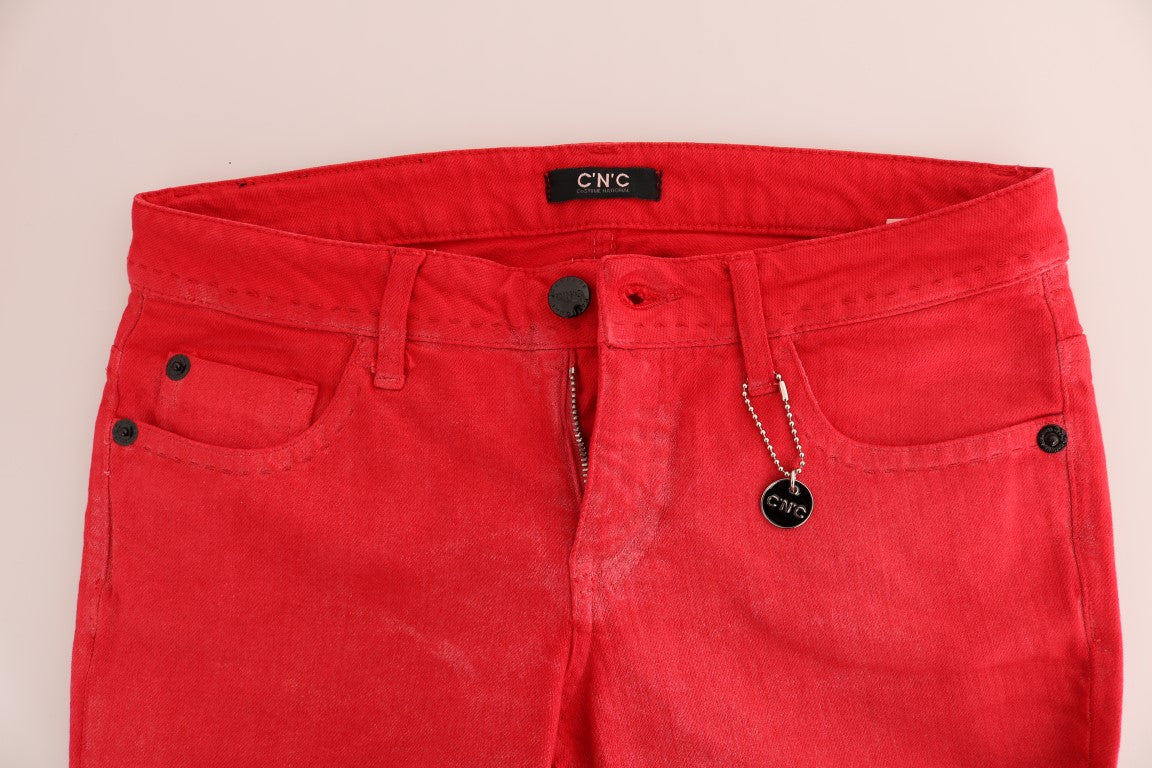 Red denim jeans on a white background