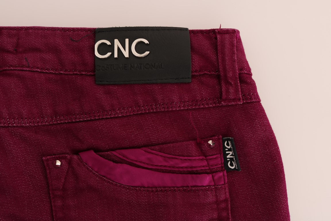 Pair of burgundy jeans with a label on the waistband