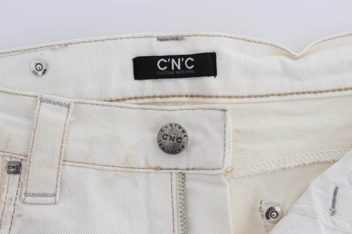 Pair of light beige jeans with visible stitching and brand label