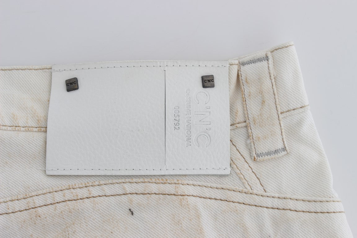 Pair of light wash denim jeans with visible stitching and tag