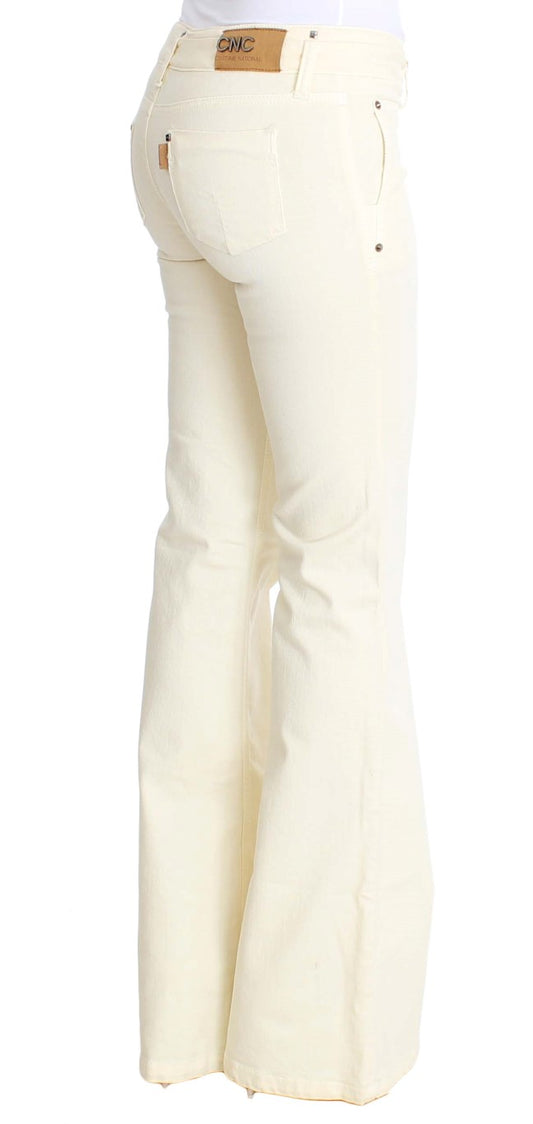 Pair of women's flared jeans in a light yellow color