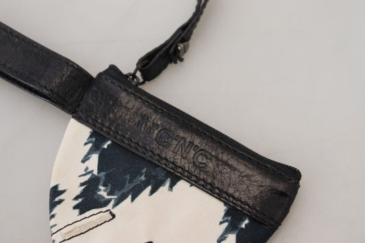 Black leather crossbody bag with a patterned fabric panel
