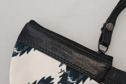 Black leather crossbody bag with a floral patterned fabric panel