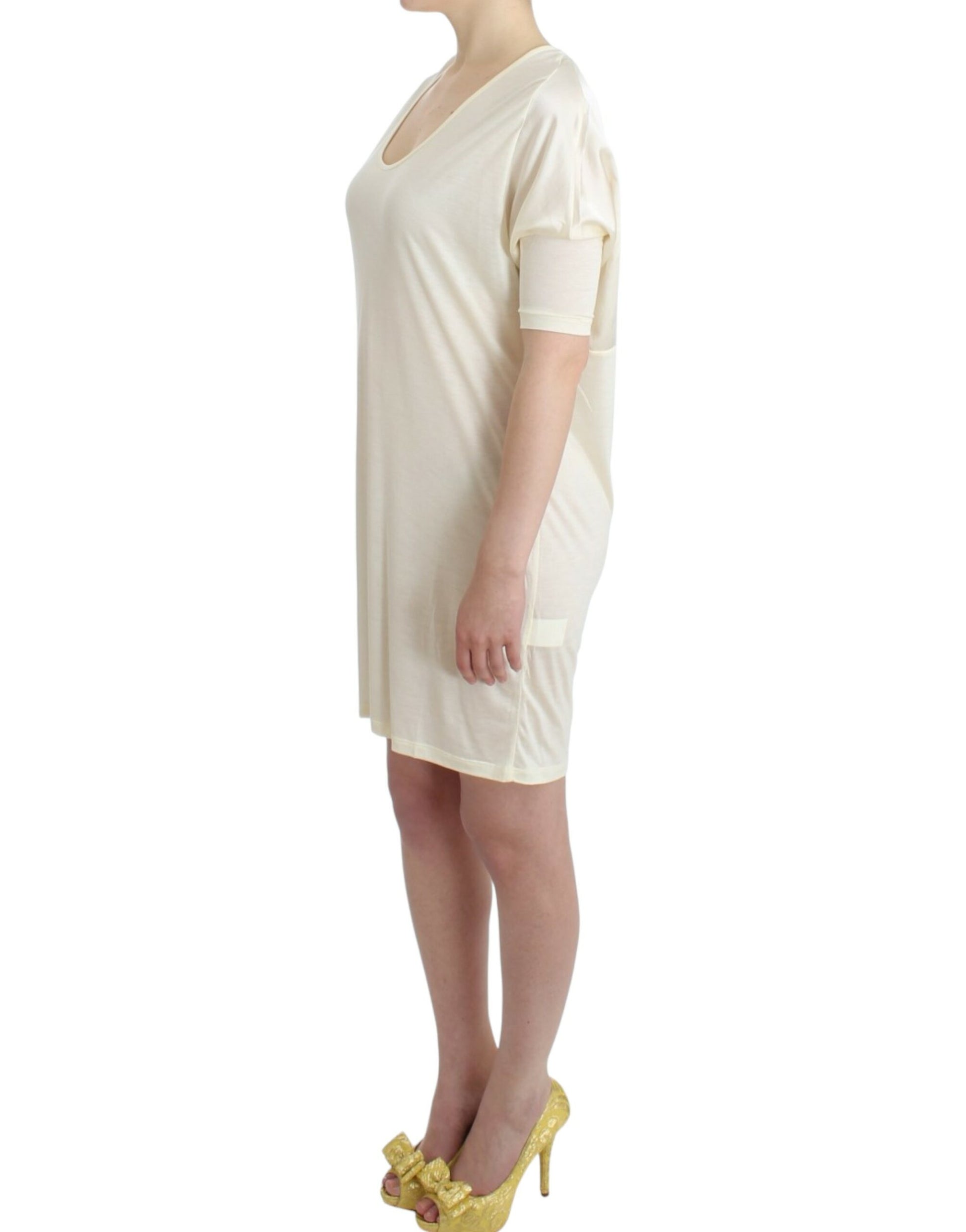 Woman's long beige dress with short sleeves and high neckline