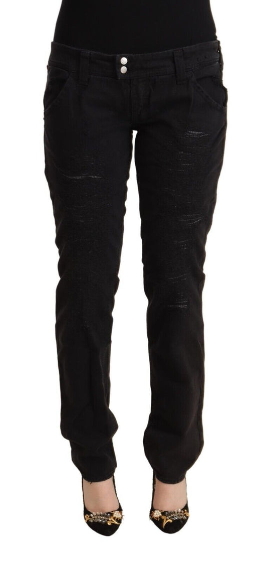 Pair of black skinny jeans with distressed details