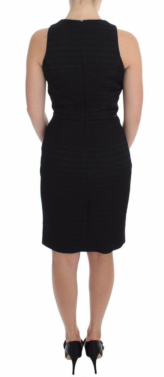 A black knee length dress with a sheath silhouette, suitable for evening or party wear