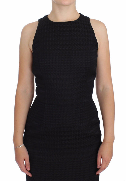 A black knee length dress with a sheath design, suitable for evening or party wear