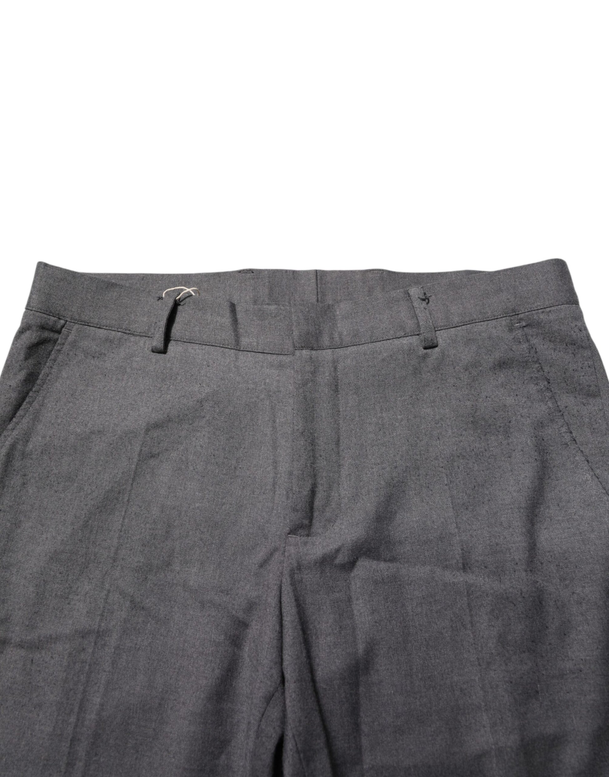 A pair of gray polyester formal dress trousers with visible stitching and a button closure