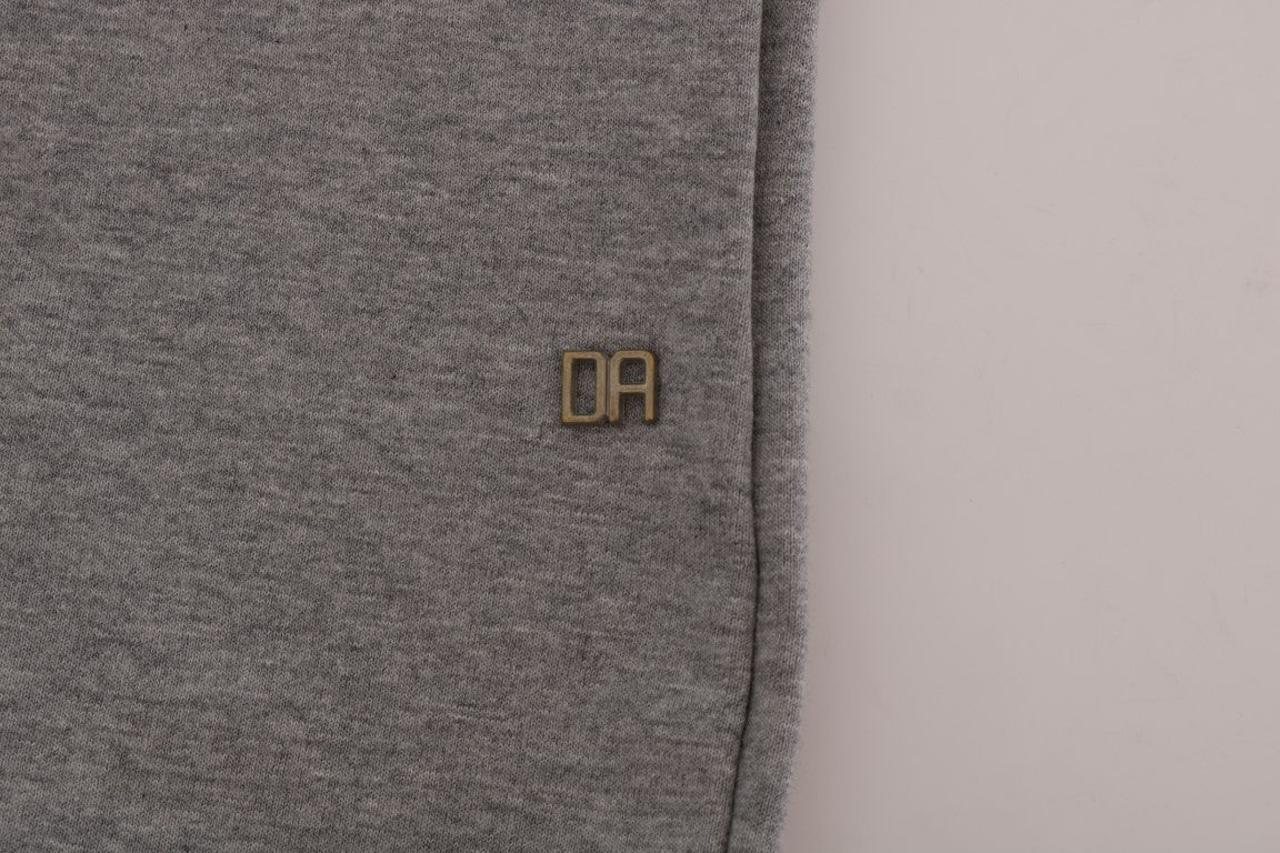 Grey fabric with embroidered initials on a white background