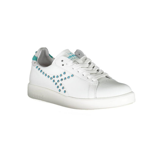 White leather sneakers with blue laces and silver studs on side