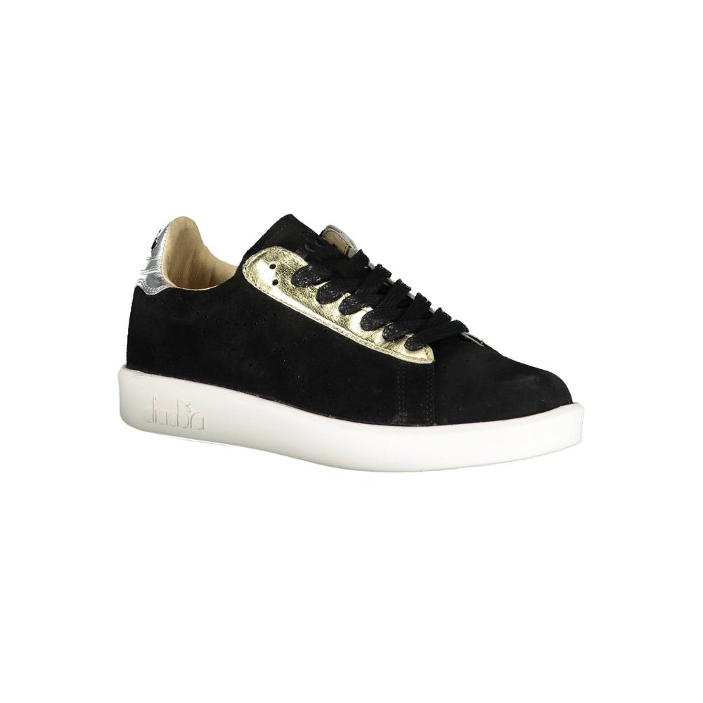 Black sneaker with white sole and gold accents on laces