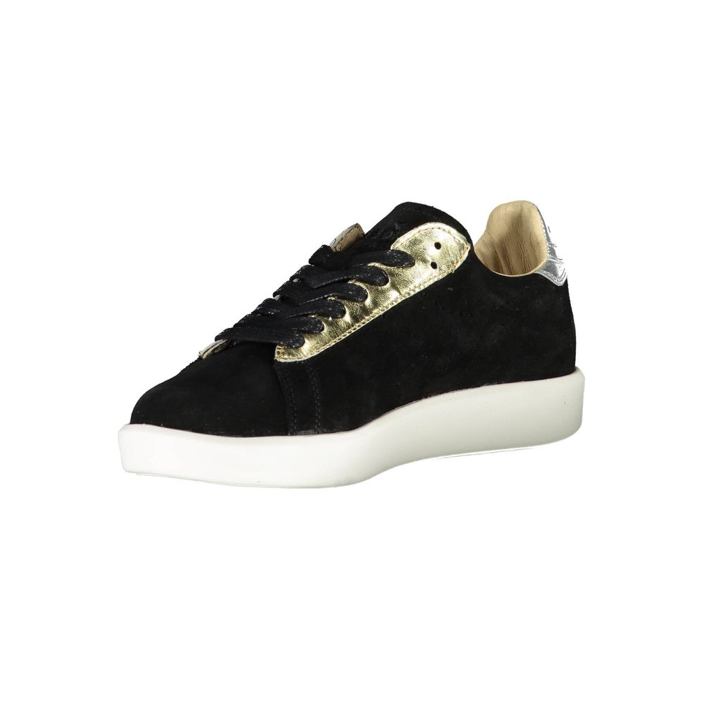 Black velvet sneaker with gold laces and white sole