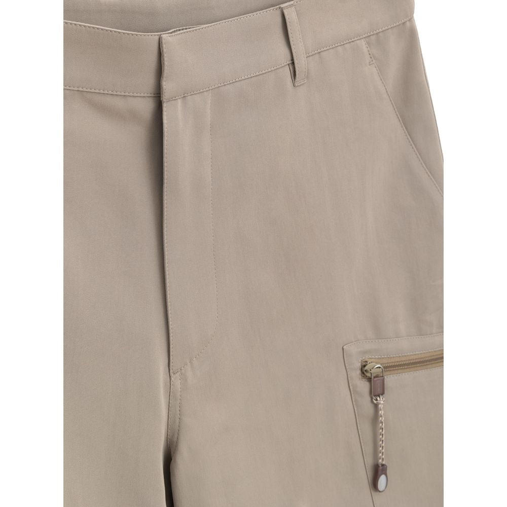Tan pants with pockets and zippered pocket on left leg