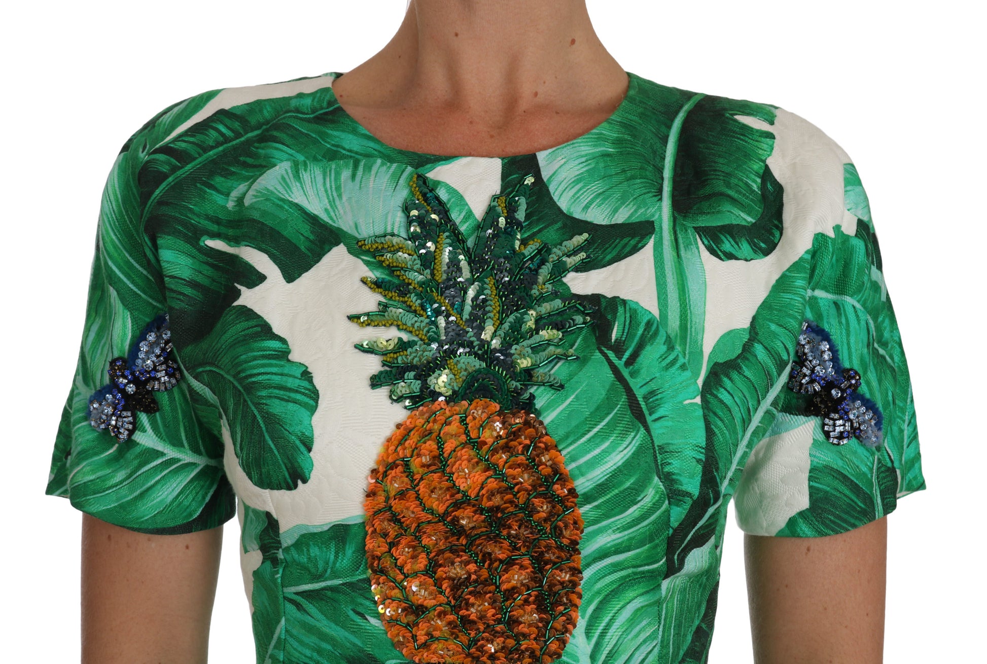 Green and white dress with banana leaf and pineapple design, featuring crystals