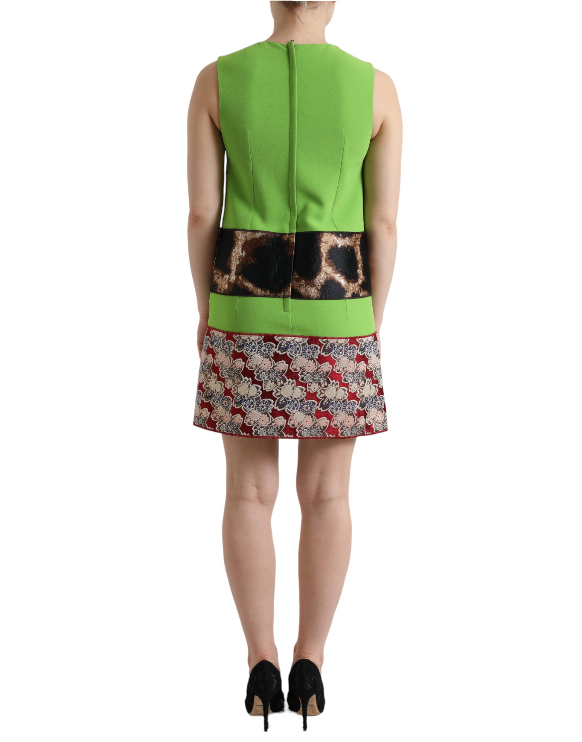 A sleeveless dress with a green panel and a patterned skirt