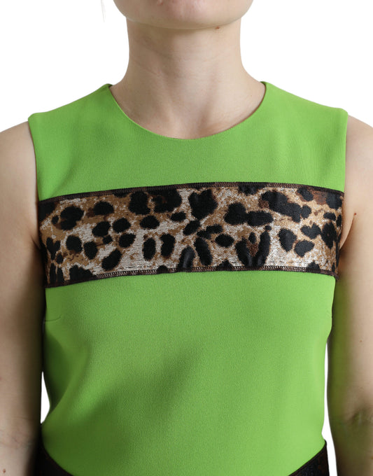 A sleeveless panelled shift dress in apple green with a leopard print border