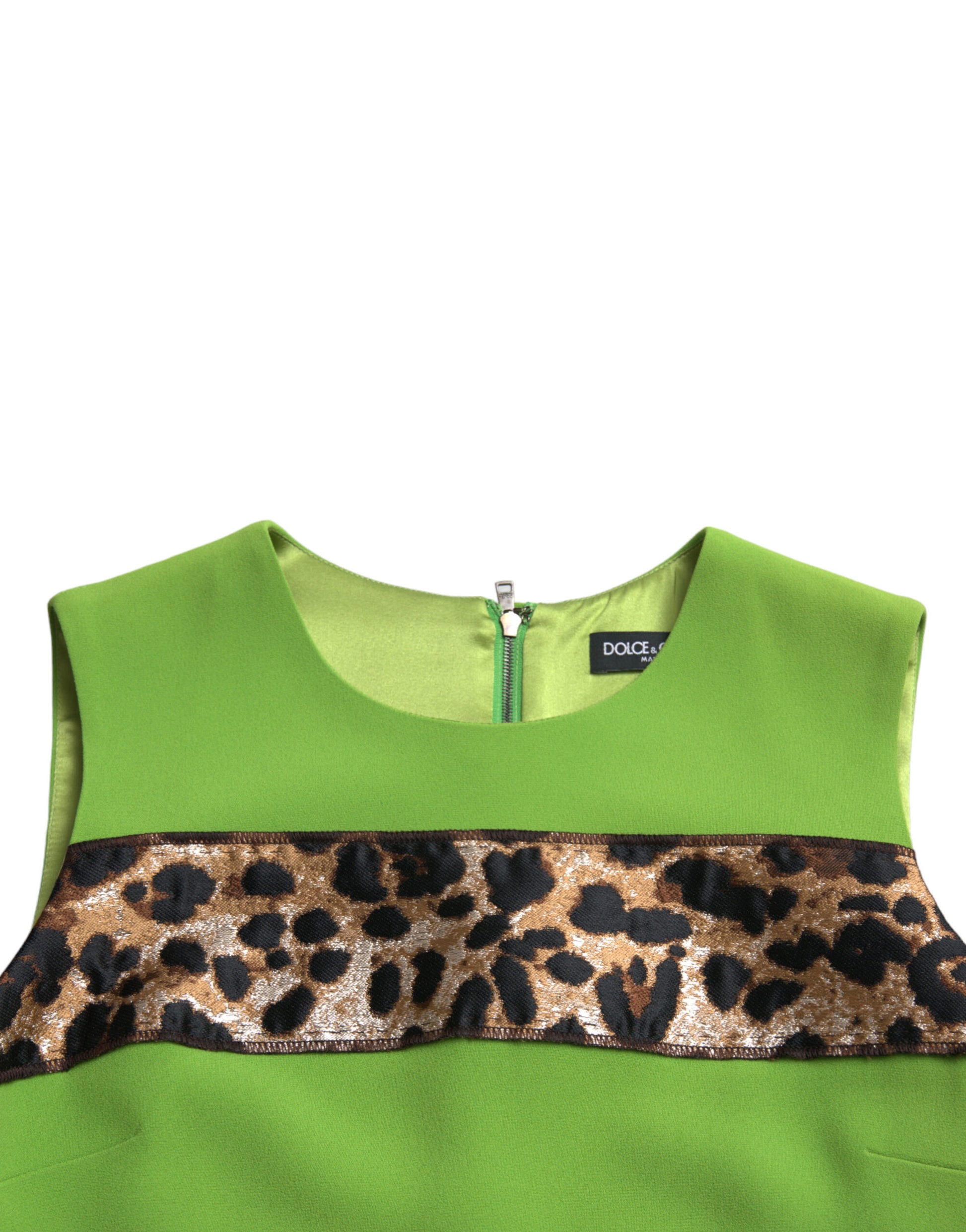 A sleeveless green dress with a panelled design and a leopard print border