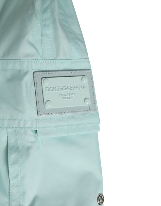 Light blue raincoat with brand label on sleeve