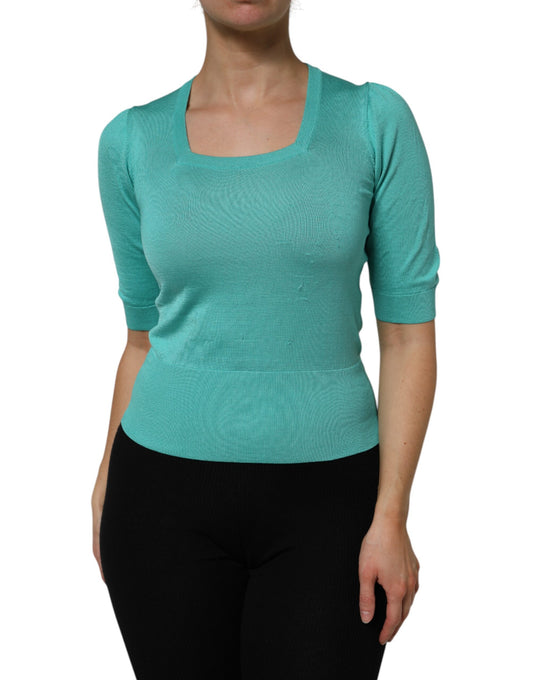 Woman wearing long sleeve blue top