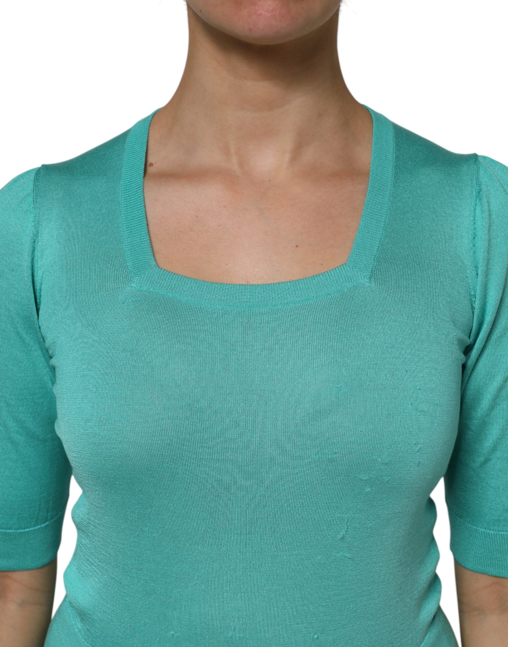 Woman wearing a blue long sleeve top