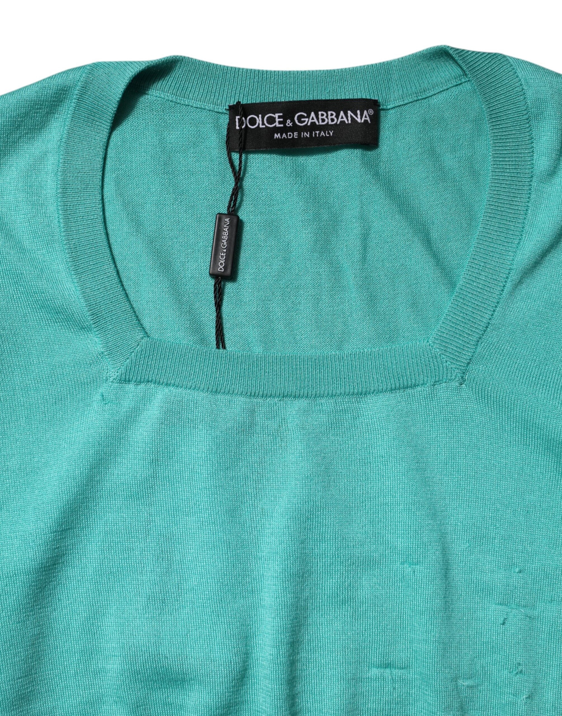 Green sweater with tag on neck