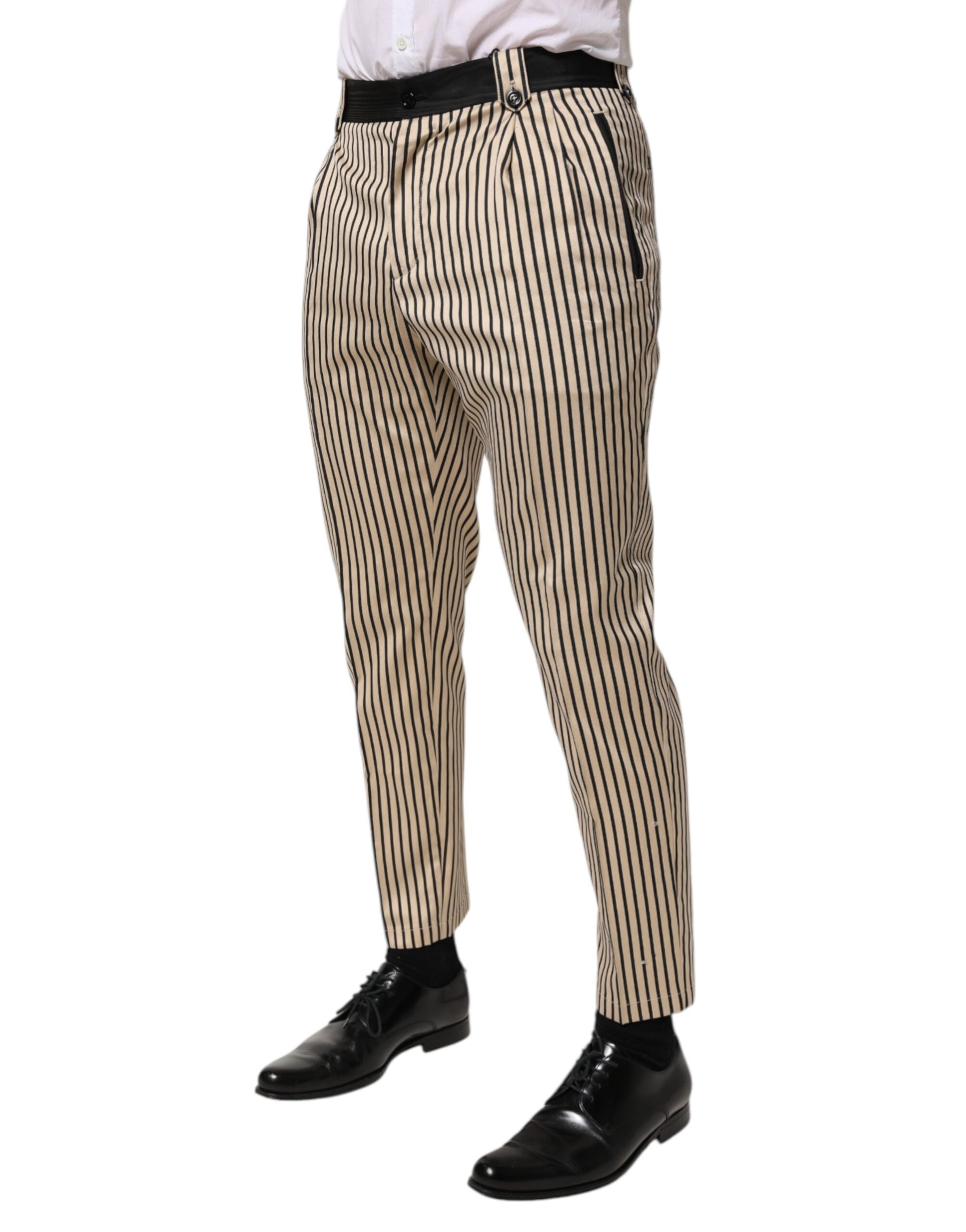 Man wearing striped pants and black shoes