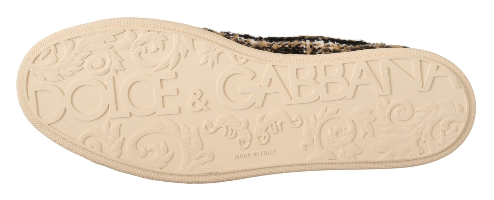 Pair of tan shoes with embossed logo and design elements