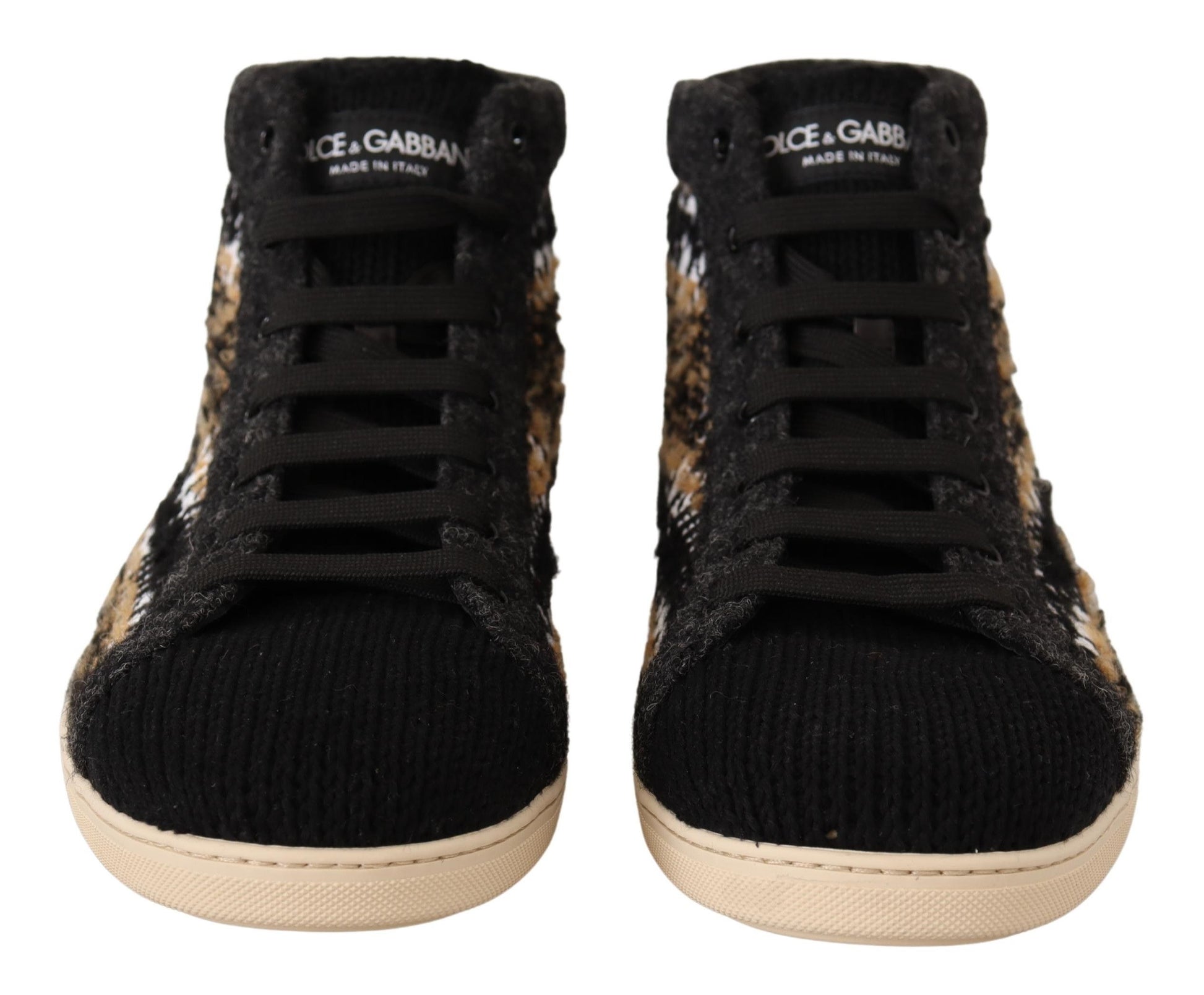 Pair of black and white sneakers with a cheetah print pattern on the side
