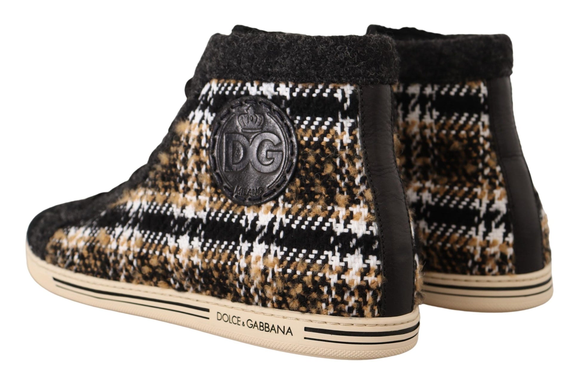 Pair of boots with a plaid pattern and a logo on the side