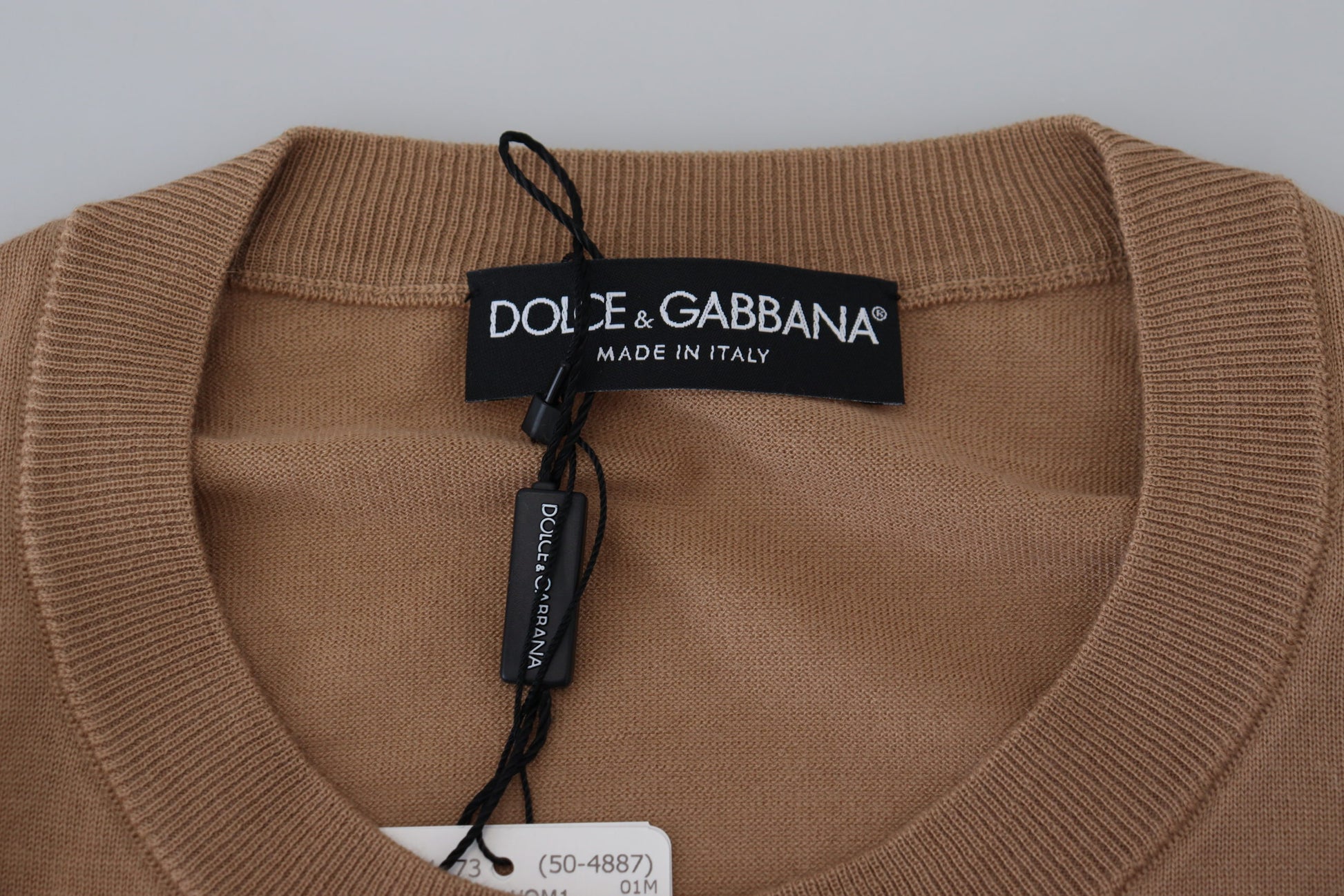 Brown sweater on hanger